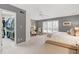 Spacious bedroom boasts a ceiling fan, gray walls, and a large walk-in closet at 103 Bruce Dr, Cary, NC 27511