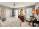 Cozy bedroom featuring a four-poster bed, shutters, and traditional-style furnishings at 103 Bruce Dr, Cary, NC 27511
