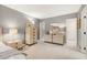 This bedroom features carpet floors, light-colored furniture, lamps, and doors to other rooms at 103 Bruce Dr, Cary, NC 27511
