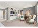 Comfortable bedroom with built-in bookshelves, a seating area, and natural light at 103 Bruce Dr, Cary, NC 27511