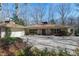 Charming single-story home with a well-manicured front yard and circular driveway at 103 Bruce Dr, Cary, NC 27511