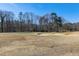 Scenic golf course view with the putting green, sand bunkers, and winter dormant grass at 103 Bruce Dr, Cary, NC 27511