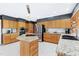 Spacious kitchen with stainless steel appliances, granite countertops, and a large center island at 103 Bruce Dr, Cary, NC 27511