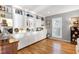 Bright living room featuring built-in shelving and storage surrounding a window with shutters at 103 Bruce Dr, Cary, NC 27511