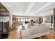 Spacious living room with hardwood floors, a sleek fireplace, and a mirrored wall at 103 Bruce Dr, Cary, NC 27511
