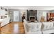 Bright living room featuring hardwood floors, a cozy fireplace and built-in storage at 103 Bruce Dr, Cary, NC 27511