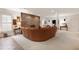 Spacious living room boasts stone fireplace, neutral carpet, and large leather sofa with modern design at 103 Bruce Dr, Cary, NC 27511