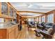 Spacious living area with wood beam ceiling, natural lighting, and cozy seating at 103 Bruce Dr, Cary, NC 27511