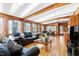 Living room featuring wood paneling, hardwood flooring, and a skylight at 103 Bruce Dr, Cary, NC 27511
