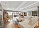 Large living room featuring hardwood floors, fireplace, mirrored wall and open concept view at 103 Bruce Dr, Cary, NC 27511