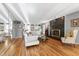 Bright living room featuring a mirrored wall and fireplace with black tile surround at 103 Bruce Dr, Cary, NC 27511