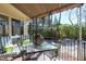Cozy patio with stylish furniture, a glass table, and a leafy view creating a relaxing outdoor space at 103 Bruce Dr, Cary, NC 27511