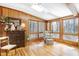 Bright sunroom filled with natural light, a skylight, and hardwood floors at 103 Bruce Dr, Cary, NC 27511