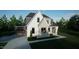 Two-story home featuring a brick facade, white vertical siding and two-car garage at 1104 Tobacco Row Ct, Zebulon, NC 27597