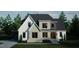 Charming two-story home featuring a brick facade, contrasting siding and dark roof at 1104 Tobacco Row Ct, Zebulon, NC 27597