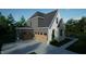Side view of a modern home with a gray exterior, two-car garage, and driveway at 1104 Tobacco Row Ct, Zebulon, NC 27597