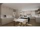 Gourmet kitchen featuring an island, marble countertops, and a dining area with modern appliances at 1104 Tobacco Row Ct, Zebulon, NC 27597