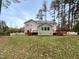 The backyard features a deck, a picket fence, and mature trees at 11308 Leesville Rd, Raleigh, NC 27613