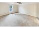 Spacious bedroom with neutral carpet, a window, and ample natural light at 11308 Leesville Rd, Raleigh, NC 27613