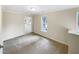 A bright bedroom featuring neutral walls, plush carpeting and plenty of natural light at 11308 Leesville Rd, Raleigh, NC 27613