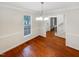 Dining room with wood floor, chandelier and view to stairs at 11308 Leesville Rd, Raleigh, NC 27613