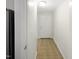 Inviting hallway featuring neutral tile flooring and a bright white front door at 11308 Leesville Rd, Raleigh, NC 27613