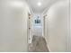 View down neutral hallway towards bedroom at 11308 Leesville Rd, Raleigh, NC 27613