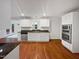 The spacious kitchen features stainless appliances, white cabinets, and stone countertops at 11308 Leesville Rd, Raleigh, NC 27613