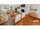 Bright living room featuring a fireplace, wood floors, and modern decor at 11308 Leesville Rd, Raleigh, NC 27613