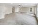 Spacious living room featuring neutral carpeting, recessed lighting, and natural light from windows at 11308 Leesville Rd, Raleigh, NC 27613