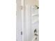 Close-up of a clean, white shower with a built-in shower head and shelving at 11308 Leesville Rd, Raleigh, NC 27613