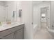 Clean bathroom with vanity, chrome faucet, tub, and tiled flooring at 126 Belmont Stakes Ln, Wendell, NC 27591