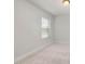 Bedroom featuring neutral carpeting and a window with blinds at 126 Belmont Stakes Ln, Wendell, NC 27591