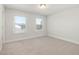 Bright and airy bedroom with neutral carpeting and multiple windows with blinds at 126 Belmont Stakes Ln, Wendell, NC 27591