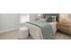 Relaxing bedroom featuring a comfortable bed with stylish bedding and a soft ottoman at 126 Belmont Stakes Ln, Wendell, NC 27591