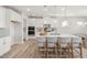 Bright kitchen featuring an oversized island, white cabinets, and stainless appliances at 126 Belmont Stakes Ln, Wendell, NC 27591