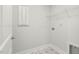 Laundry room featuring star pattern flooring, shelving, and white walls at 126 Belmont Stakes Ln, Wendell, NC 27591