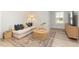 Bright living room featuring a cozy sofa, woven coffee table, and patterned rug at 126 Belmont Stakes Ln, Wendell, NC 27591