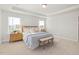 Bright main bedroom with large windows, neutral décor, and a sitting area at 126 Belmont Stakes Ln, Wendell, NC 27591