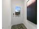 A bright entryway featuring a door with a window and an abstract painting at 1305 White Verona Way, Knightdale, NC 27545