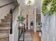 Entryway with a staircase, hardwood floors, neutral walls, and coat rack at 1328 Baez St, Raleigh, NC 27608