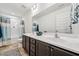 Bathroom featuring a double sink vanity with modern fixtures and coordinated shower curtain at 149 Cribbs Ln, Middlesex, NC 27557