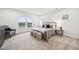 Bright bedroom with a large window, black metal bed frame, and neutral colors at 149 Cribbs Ln, Middlesex, NC 27557