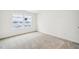 A bedroom with neutral carpeting and two windows providing natural light at 149 Cribbs Ln, Middlesex, NC 27557