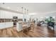 Bright, open kitchen featuring stainless steel appliances, a center island with seating, and wood flooring at 149 Cribbs Ln, Middlesex, NC 27557