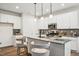 Modern kitchen with white cabinetry, granite countertops, and pendant lighting over the island at 149 Cribbs Ln, Middlesex, NC 27557