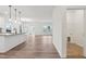 Open floor plan, kitchen with a center island overlooking living space with hard wood floors at 149 Cribbs Ln, Middlesex, NC 27557