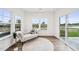 Sitting room with lots of windows overlooking the outside with a modern chaise lounge at 149 Cribbs Ln, Middlesex, NC 27557