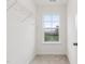 A walk-in closet featuring carpet, a window and a wire shelving system for organized storage at 149 Cribbs Ln, Middlesex, NC 27557