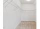 Bright walk-in closet with carpet and adjustable shelving ready for organization at 149 Cribbs Ln, Middlesex, NC 27557